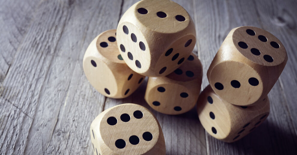 Wooden dice on a table Wooden dice on a table