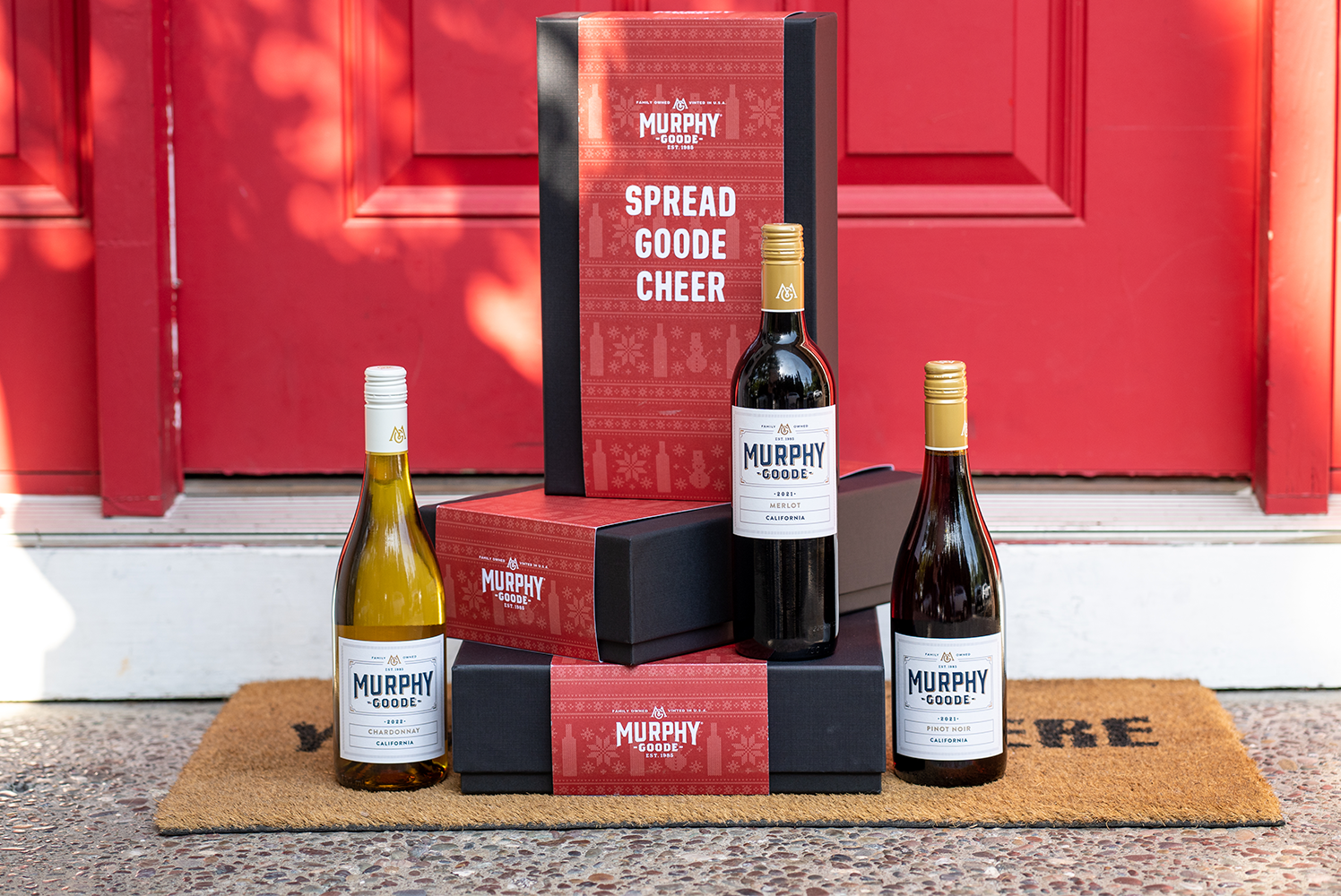 Holiday wine gifts, wrapped packages of wine on doorstep, Chardonnay, Pinot Noir, and Cabernet Sauvignon